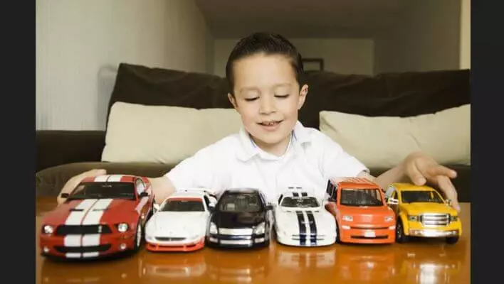 Baby lining up toys